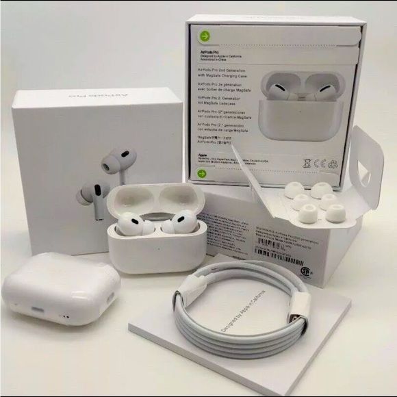 Wireless earbuds with charging case, cable, and packaging on a white background