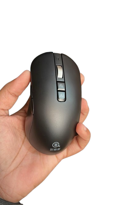 Hand holding a black computer mouse with a visible brand logo on a white background