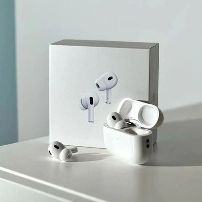 White wireless earbuds with charging case on a light surface