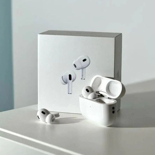 White wireless earbuds with charging case on a light surface